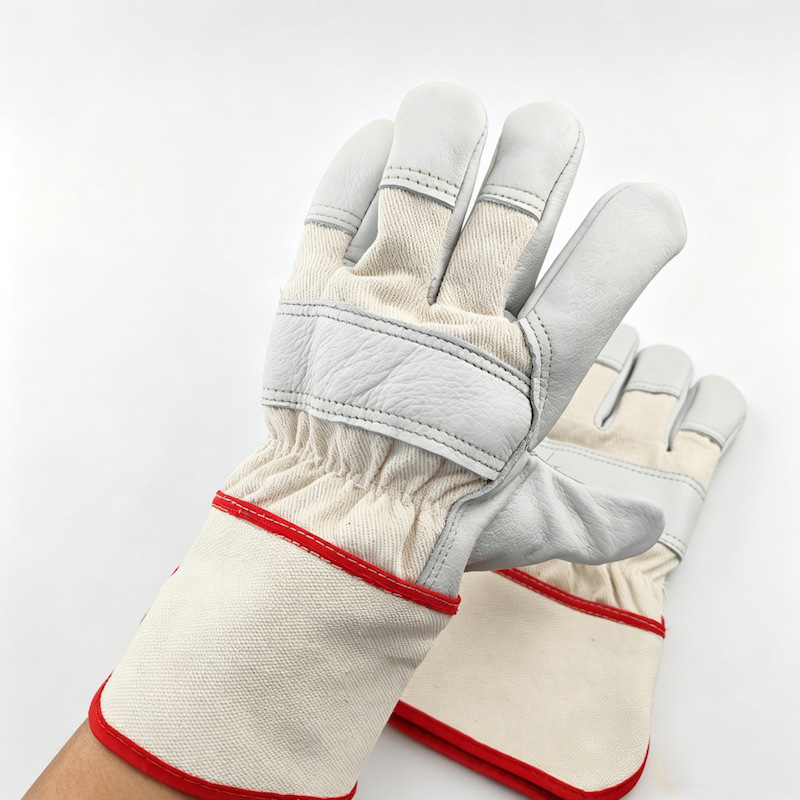 High quality cowhide leather working gloves, white leather palm, canvas cuff with red stitching High quality cowhide leather working gloves, white leather palm, canvas cuff with red stitching